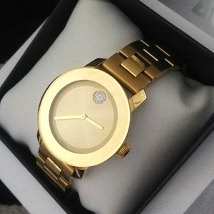 Nib movado bold gold ladies watch